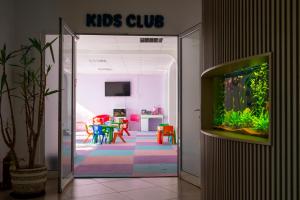 a kids club room with a fish tank in the door at Hotel Opal in Jupiter