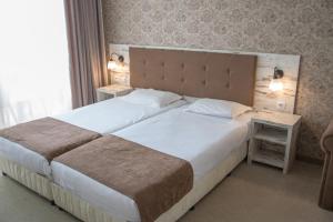 Een bed of bedden in een kamer bij Paraiso Theopolis - All Inclusive