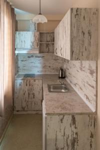 a kitchen with a sink and a counter at Paraiso Theopolis - All Inclusive in Obzor