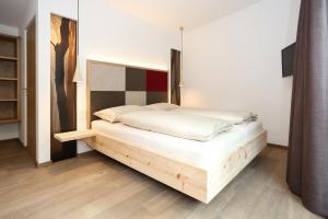 Posteľ alebo postele v izbe v ubytovaní Hotel Gasthof Höllriegl