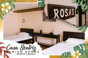 Postel nebo postele na pokoji v ubytování A&A Garden Suites