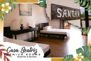 Postel nebo postele na pokoji v ubytování A&A Garden Suites