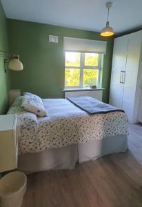 a bedroom with a bed and a window at Galway City Lovely 2 Bed Apartment in Galway