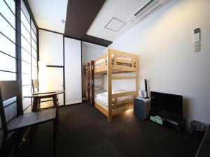 מיטה או מיטות בחדר ב-Setouchi Mangetsuso