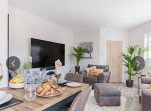 a living room with a table with food on it at The Bolthole in Margate