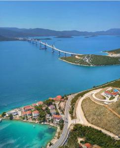 an aerial view of a bridge over a body of water at Repic Apartments in Klek