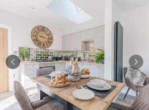 a kitchen with a table with a bowl of food on it at The Bolthole in Margate