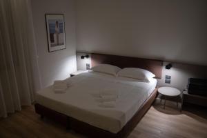 A bed or beds in a room at Hotel Orientale