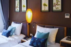 Ένα ή περισσότερα κρεβάτια σε δωμάτιο στο Hotel Emerald Waters Classy