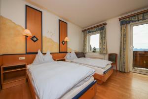 En eller flere senger på et rom på Landgasthof Franz Josef