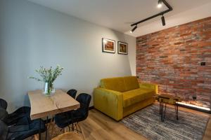 Posedenie v ubytovaní Bison Apartamenty