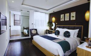 Giường trong phòng chung tại Hotel Emerald Waters Classy