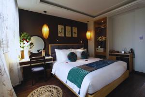 Ένα ή περισσότερα κρεβάτια σε δωμάτιο στο Hotel Emerald Waters Classy