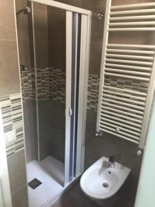 a bathroom with a shower and a sink at Berenice Suite in Taranto