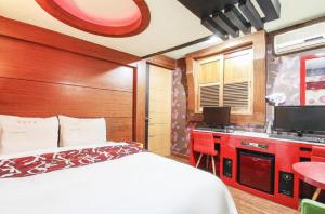 Postel nebo postele na pokoji v ubytování Couple Motel