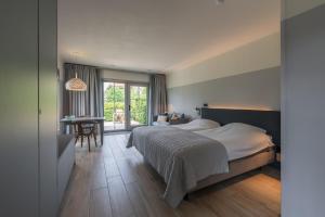 Postel nebo postele na pokoji v ubytování Villa Magnolia