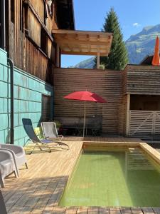 Bazén v ubytování Lenai & Linai Apartments nebo v jeho okolí