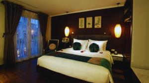 Ένα ή περισσότερα κρεβάτια σε δωμάτιο στο Hotel Emerald Waters Classy
