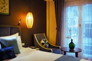 Ένα ή περισσότερα κρεβάτια σε δωμάτιο στο Hotel Emerald Waters Classy