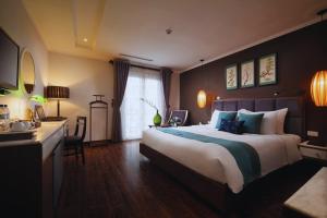 Ένα ή περισσότερα κρεβάτια σε δωμάτιο στο Hotel Emerald Waters Classy