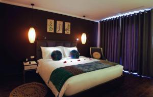 Ένα ή περισσότερα κρεβάτια σε δωμάτιο στο Hotel Emerald Waters Classy
