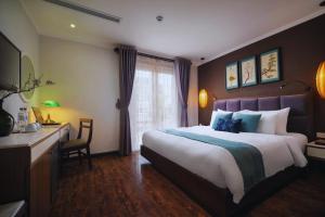 Ένα ή περισσότερα κρεβάτια σε δωμάτιο στο Hotel Emerald Waters Classy