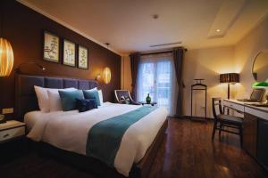 Ένα ή περισσότερα κρεβάτια σε δωμάτιο στο Hotel Emerald Waters Classy