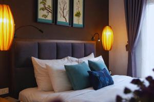 Ένα ή περισσότερα κρεβάτια σε δωμάτιο στο Hotel Emerald Waters Classy