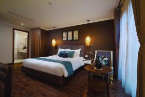 Ένα ή περισσότερα κρεβάτια σε δωμάτιο στο Hotel Emerald Waters Classy