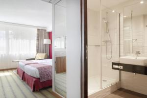 Postel nebo postele na pokoji v ubytování Holiday Inn Lille Ouest Englos by IHG