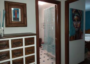 a room with a bathroom with a painting on the wall at JALEPA in Muxia +23 photos