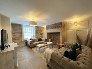 a living room with two couches and a fireplace at Mulberry House - Morpeth Town Centre - Hot Tub in Morpeth