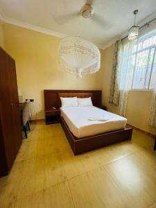 Postel nebo postele na pokoji v ubytování Boshowa Villas