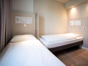 ibis budget Fribourg客房内的一张或多张床位