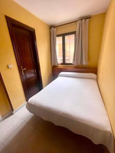 Postel nebo postele na pokoji v ubytování Hostal Rural Sositana