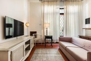 TV a/nebo společenská místnost v ubytování Casa Vacanze Alessandro 2