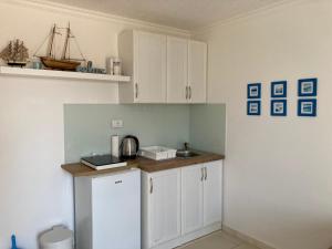 Eldhús eða eldhúskrókur á ORA apartments