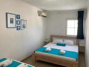 Rúm í herbergi á ORA apartments