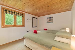 Postel nebo postele na pokoji v ubytování Everwyn Lodge - Luxury Lodge with Hot Tub