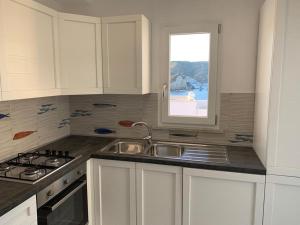 Kuchyňa alebo kuchynka v ubytovaní Immobiliare Turistcasa - Corso Umberto 111