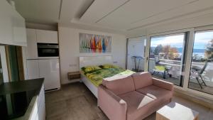 TV a/nebo společenská místnost v ubytování Apartment No. 29 - Riviéra Lipno nad Vltavou 511
