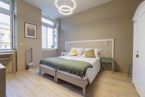 מיטה או מיטות בחדר ב-Interno 6 Guest House
