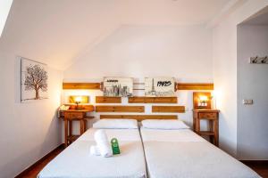 Postel nebo postele na pokoji v ubytování Hotel Doña Matilde