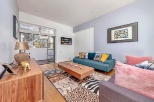 a living room with a couch and a table at Interior-Designer Apartment with 2 TERRACES in London