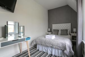 Postel nebo postele na pokoji v ubytování Sefton Park Hotel