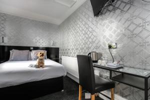 Postel nebo postele na pokoji v ubytování Sefton Park Hotel