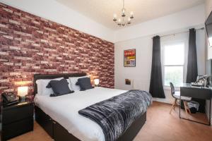 Postel nebo postele na pokoji v ubytování Sefton Park Hotel
