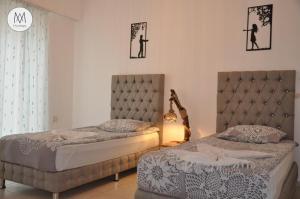 Postel nebo postele na pokoji v ubytování Atamert hıgh class