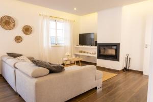 TV a/nebo společenská místnost v ubytování Casa da Lota, by Casas do Verão