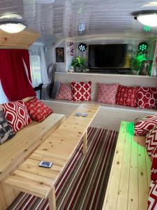 a living room with a couch and a tv at Double Decker Bus in Aberystwyth